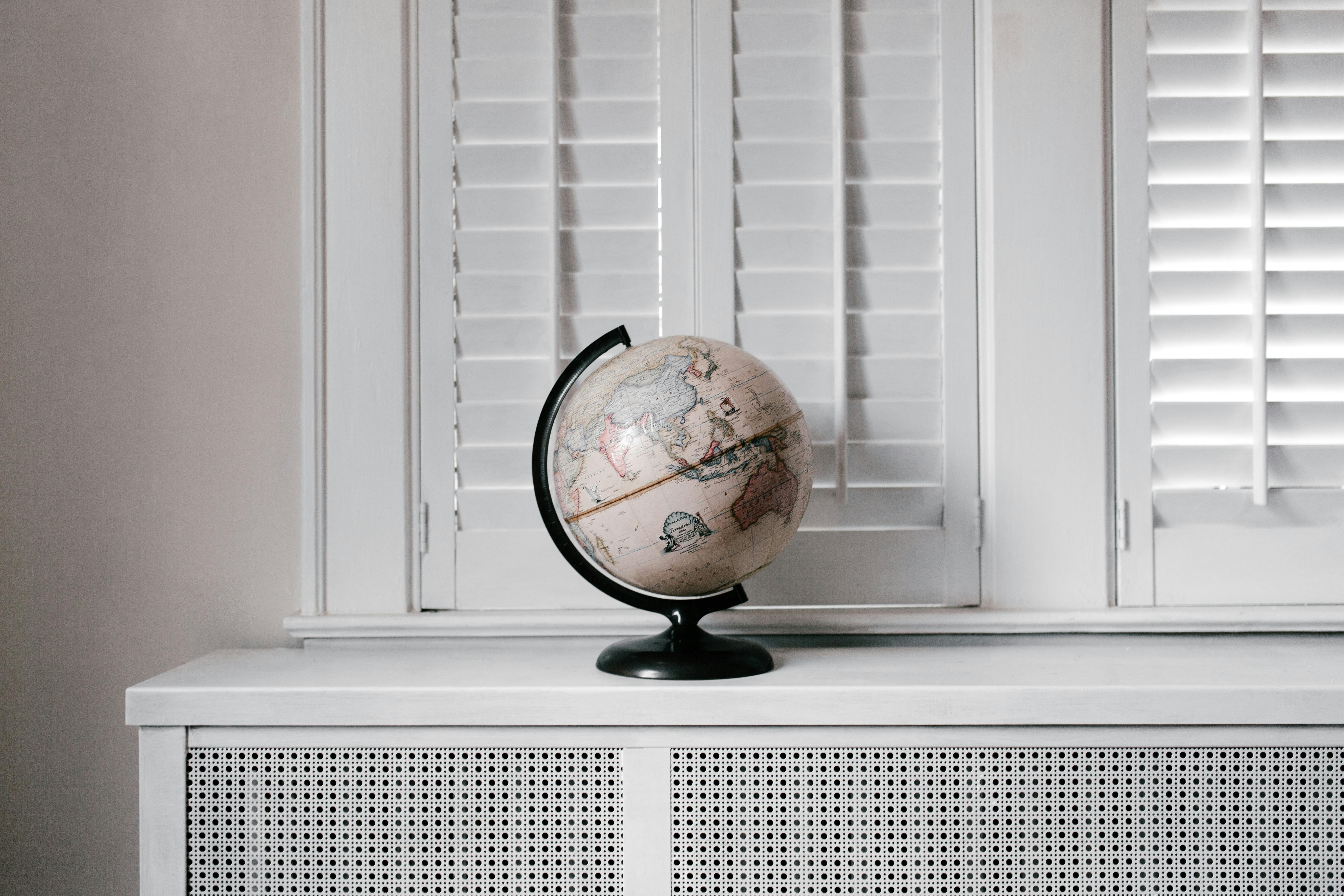 white and black desk globe