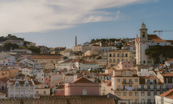 Aerial view of Lisbon's charming historic architecture under a bright sky.