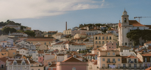 Aerial view of Lisbon's charming historic architecture under a bright sky.