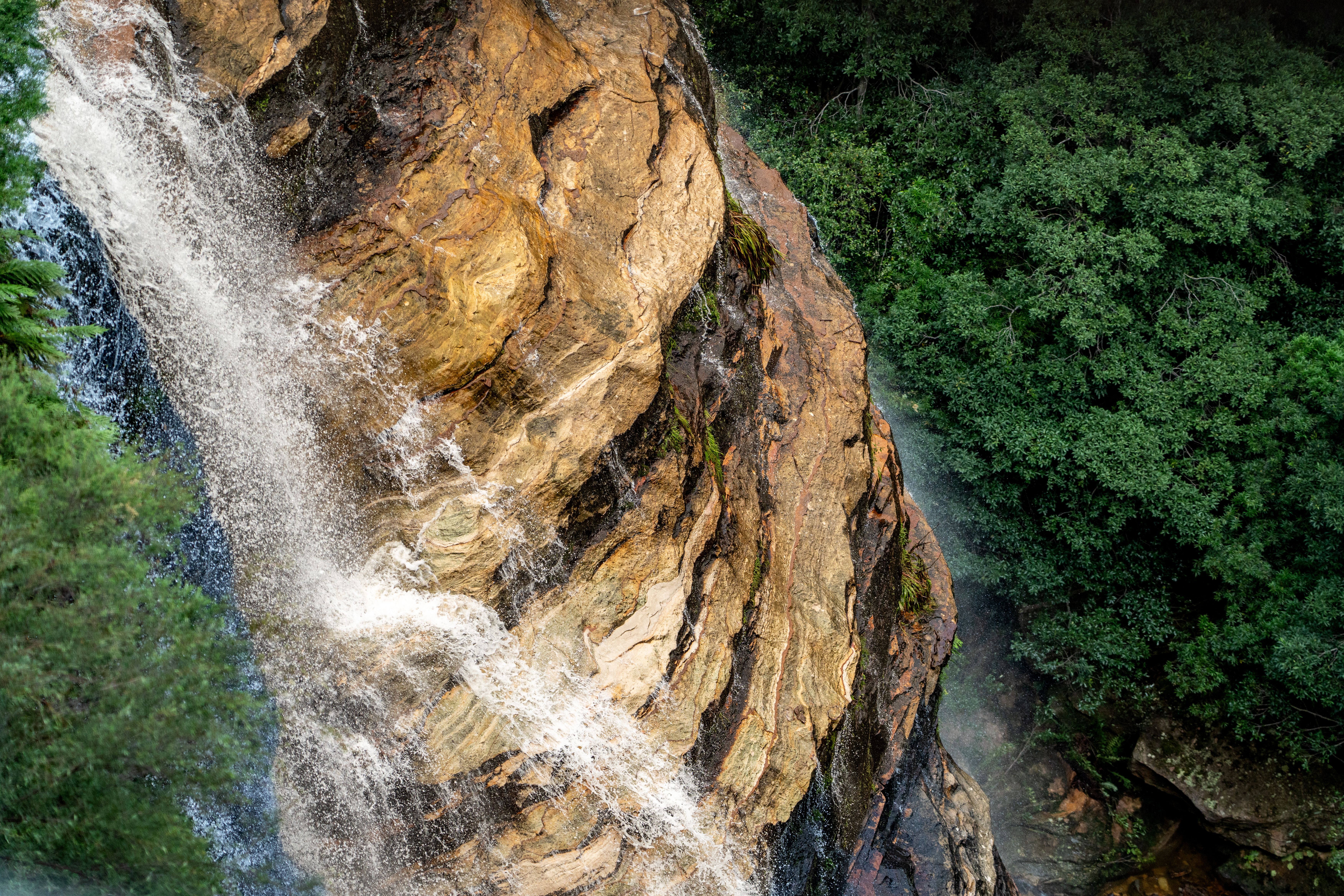 Waterfall on Rocks over Forest · Free Stock Photo