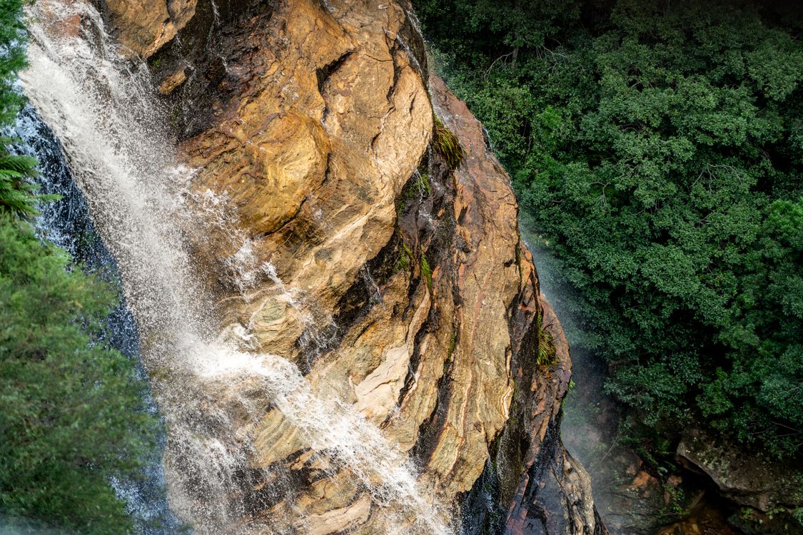Waterfall on Rocks over Forest · Free Stock Photo