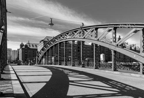 Free Black and white photo of a historic iron bridge in Hamburg, showcasing urban architecture and city streets. Stock Photo