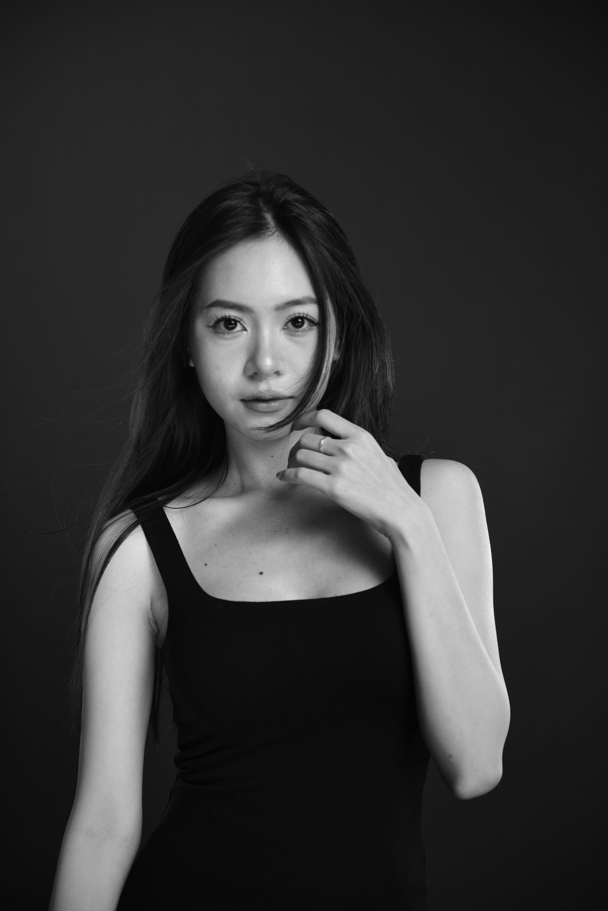Sleek straight hair with middle part