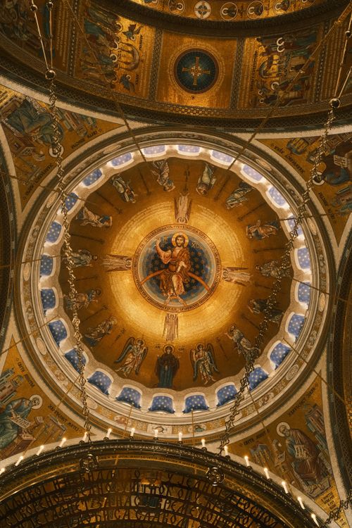 Free View of a beautifully ornate Romanian Orthodox church dome with religious frescoes. Stock Photo