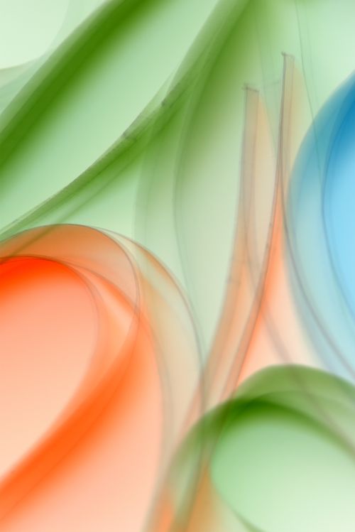 Free Captivating abstract image featuring flowing shapes in soft green, blue, and red tones. Stock Photo