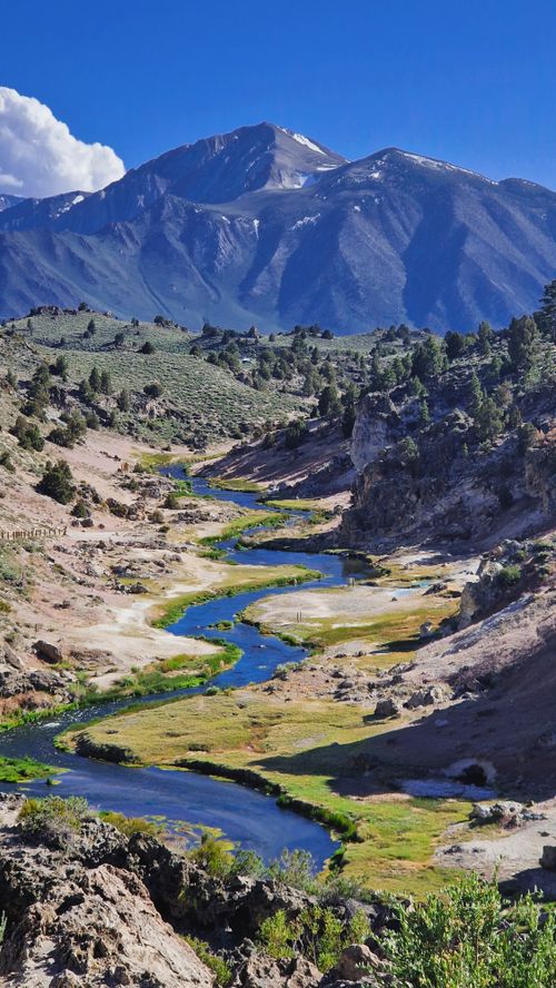 Free Beautiful mountain valley with winding river and blue sky in California. Stock Photo