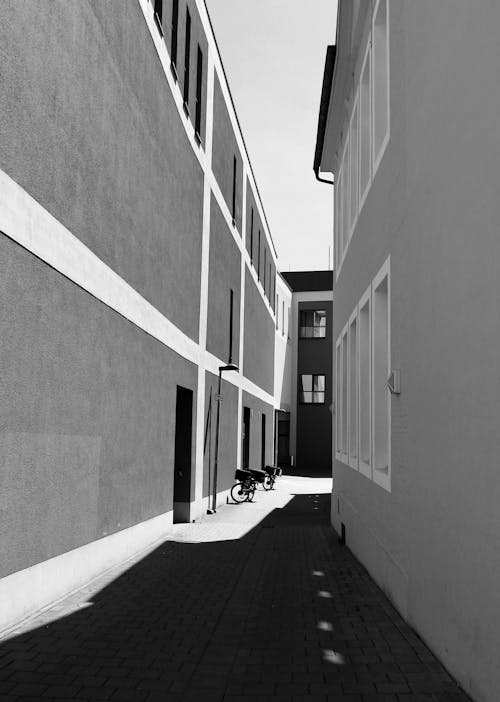 Free stock photo of bikes, black and white, hard shadow