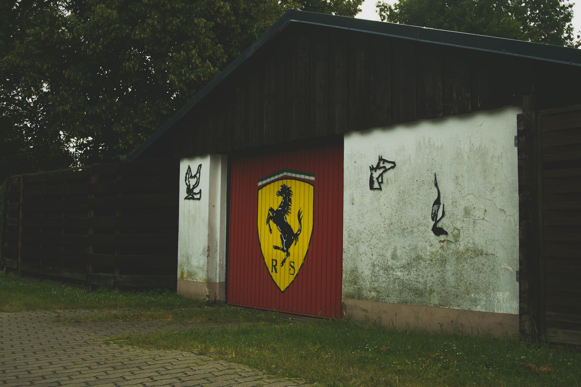 Residential Garage Shed With Ferrari Logo Graffiti on Door