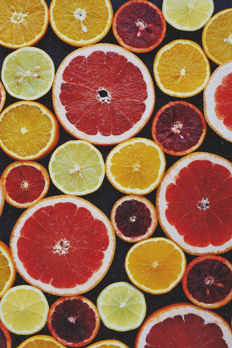 Top View Photo Of Sliced Citrus Fruits