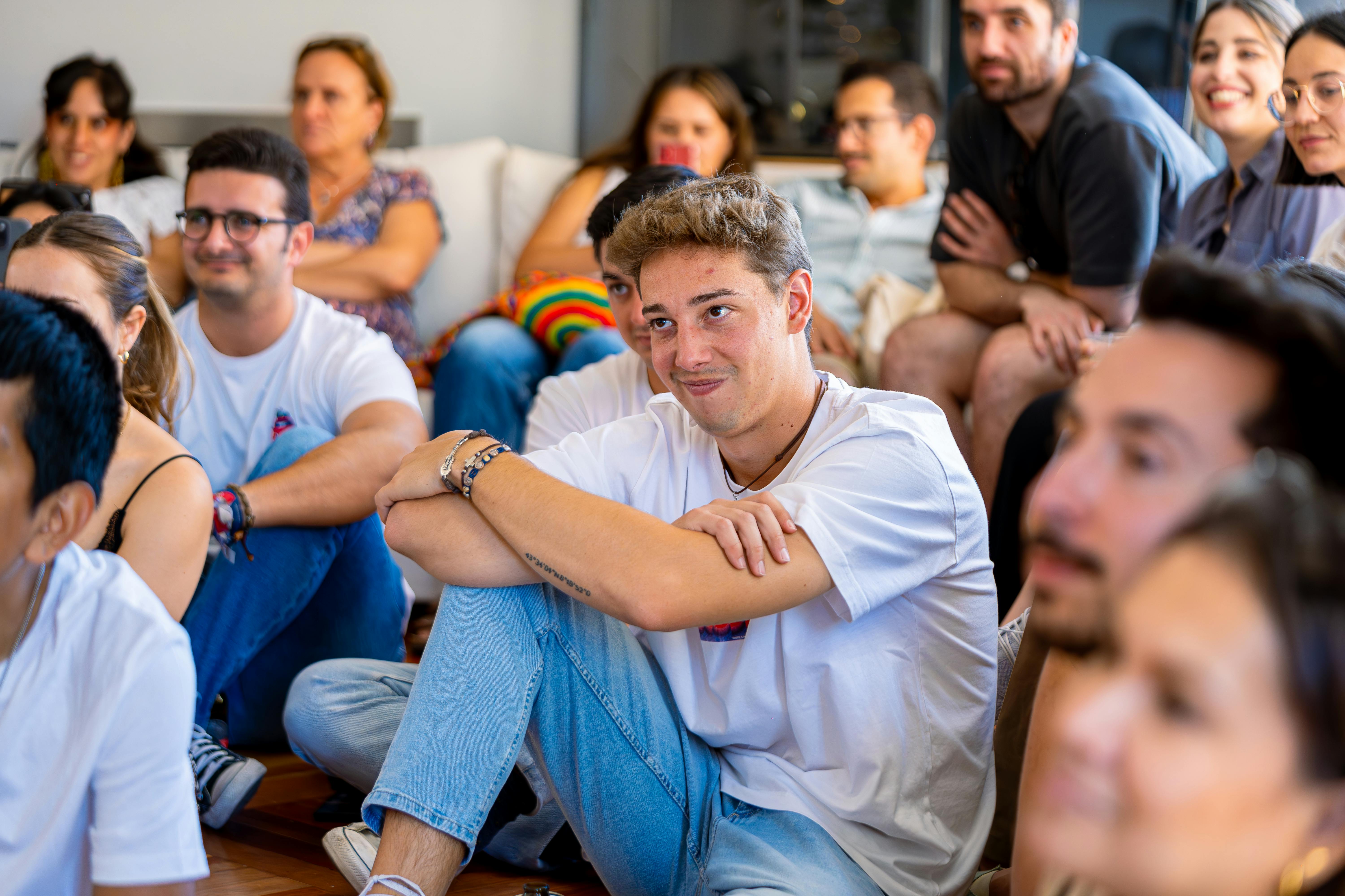 A diverse group of adults participating in a supportive group therapy session, seated in a comfortable, modern setting. - Which premier services support dual-diagnosis mental health treatment?