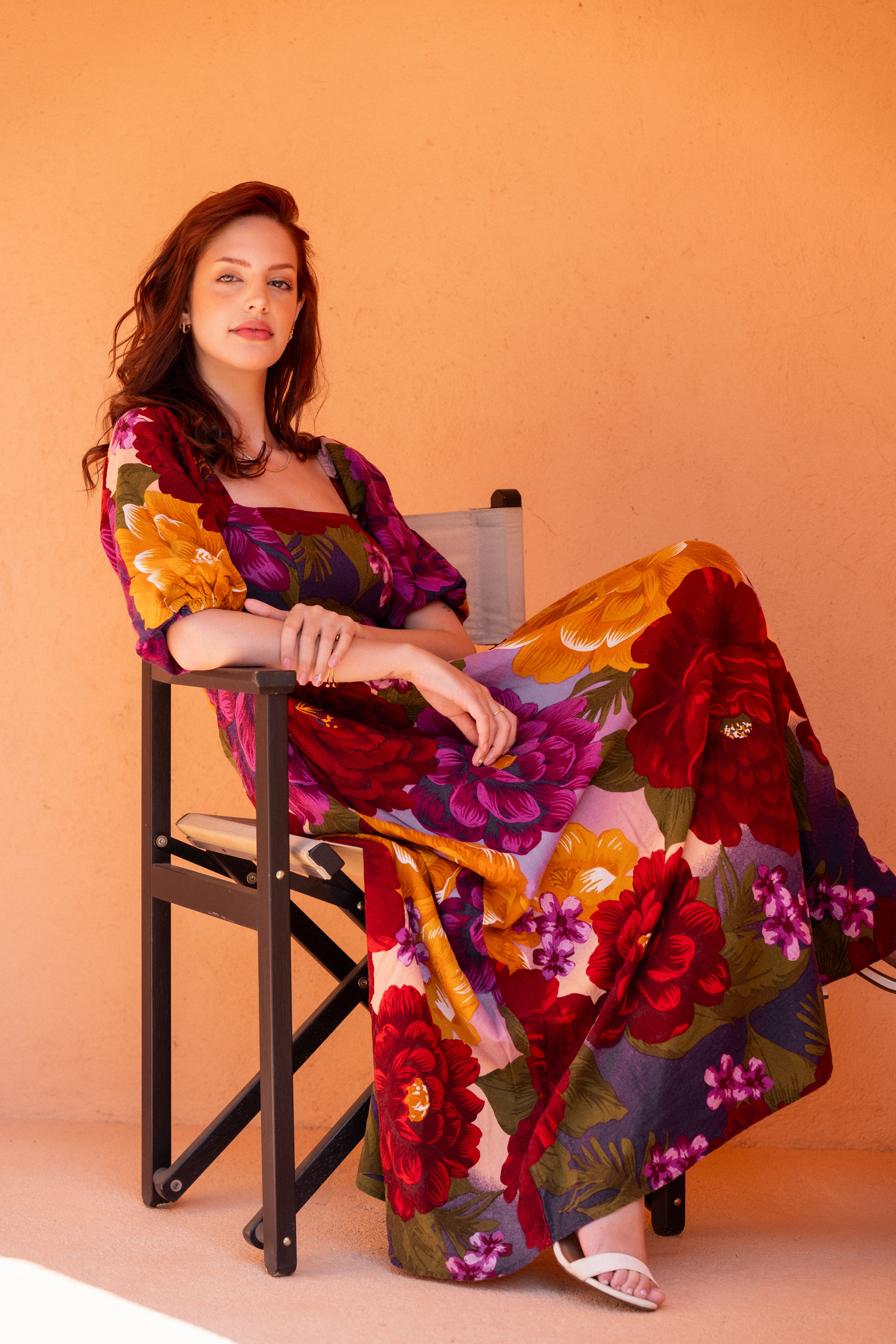 Woman Sitting in a Floral Dress · Free Stock Photo