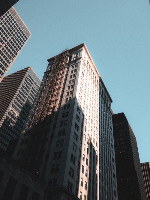 Free Tall skyscrapers emphasizing urban architecture under a clear blue sky. Stock Photo