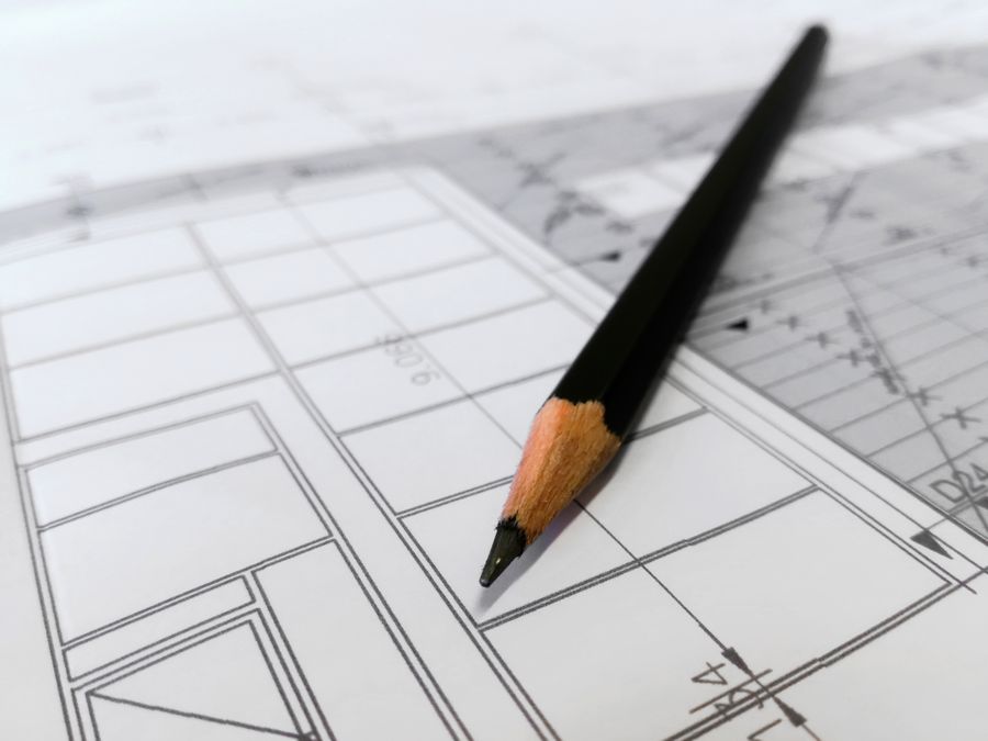 Architectural blueprint with drafting tools
