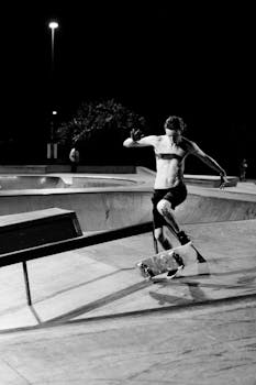 A skilled skateboarder performs a jump trick at Maroochydore Skatepark captured in black and white.
