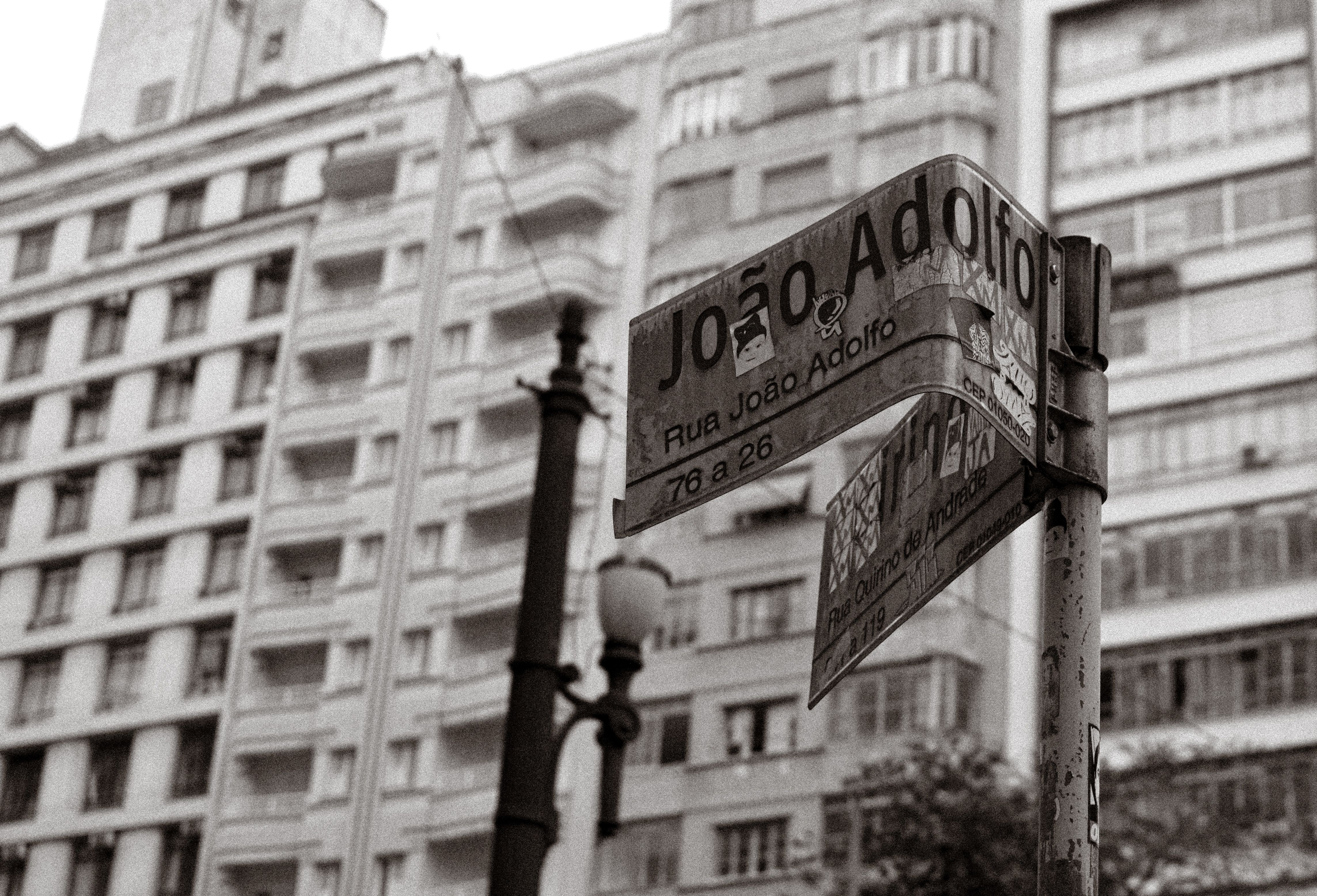 Street Sign on a Street in Black and White · Free Stock Photo