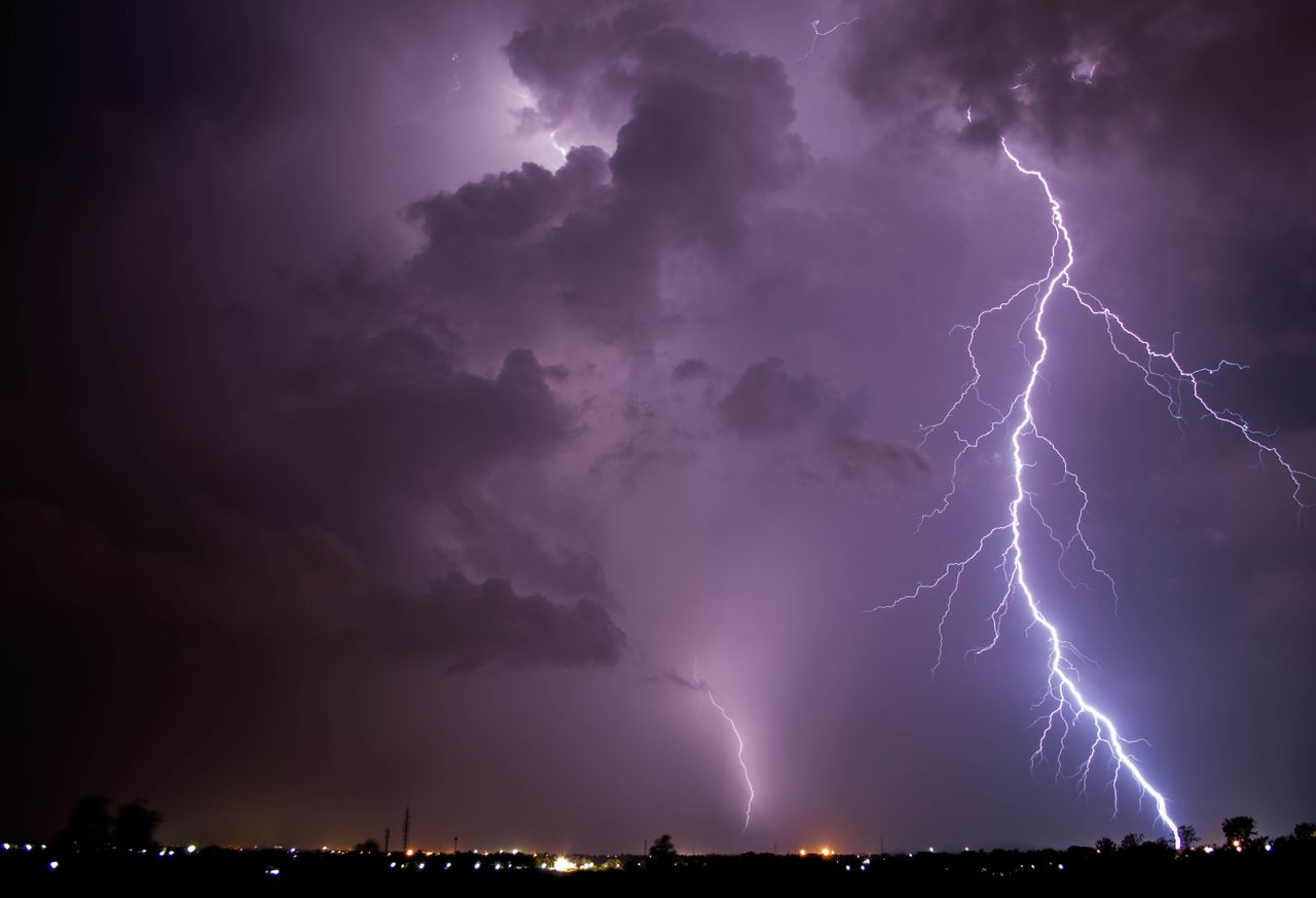 intense lightning strikes illuminate a stormy night sky over tiruchira