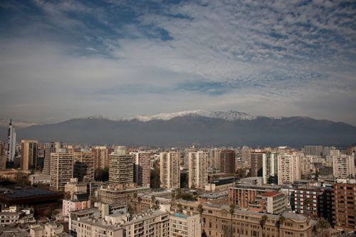Free Aerial view of Santiago, Chile showcasing modern architecture and the Andes mountains in the background. Stock Photo