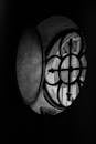 Black and White Photo of a Window with Iron Bars