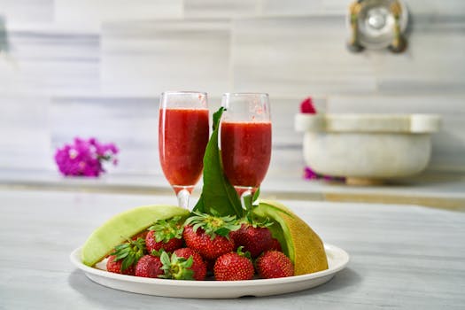 Delicious strawberry smoothies and fresh fruit platter, perfect for a healthy start.