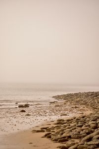 Hazy shoreline at low tide, photograph by Robledo Rafael Andrade on Pexels