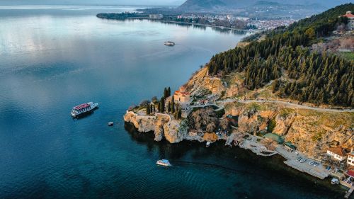 Free Stunning aerial view of Lake Ohrid, showcasing the historic St. John at Kaneo Church on the cliff. Stock Photo
