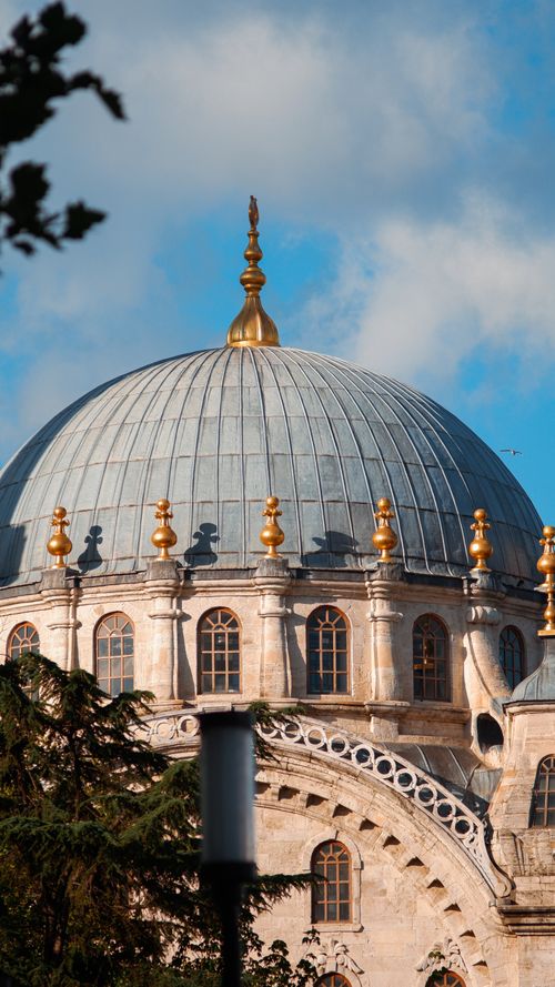 Free Elegant dome of Nusretiye Mosque showcasing Ottoman architecture against a bright blue sky. Stock Photo