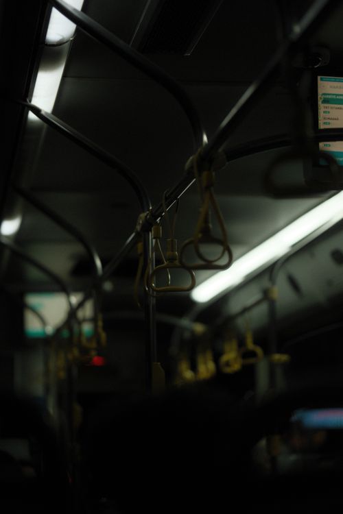 Free Moody interior of Istanbul's metro train, showing handrails at night. Stock Photo