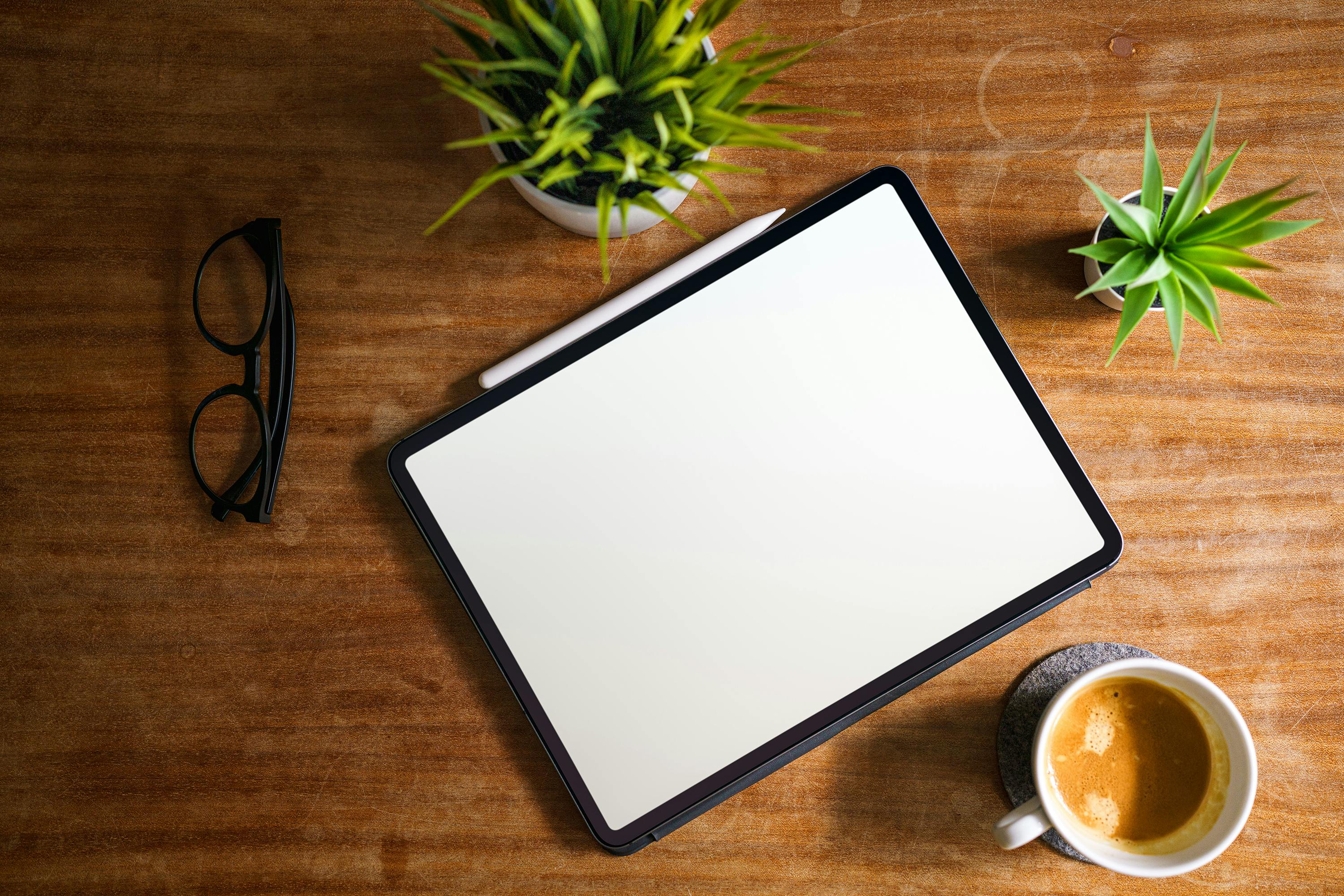 tablet lying on table clean blank white screen mockup