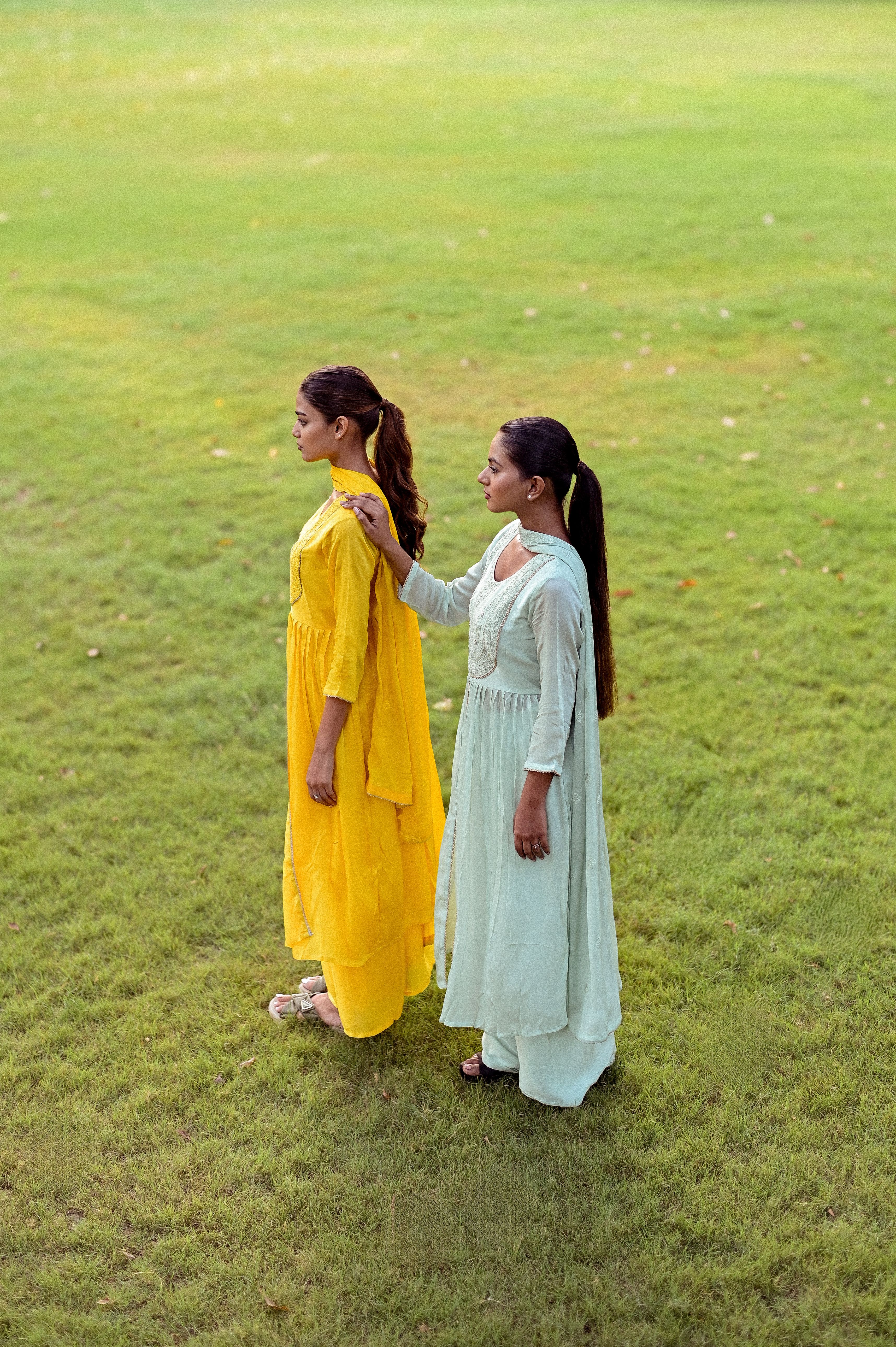 Women Standing in Traditional Dresses on Field  Free Stock Photo