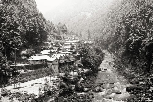 Free Serene village nestled in a lush valley near a flowing river in Kathmandu, Nepal. Stock Photo
