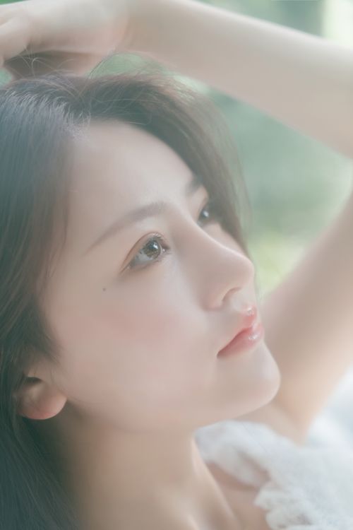 Free Soft-focus portrait of an Asian woman with long black hair in natural light. Stock Photo