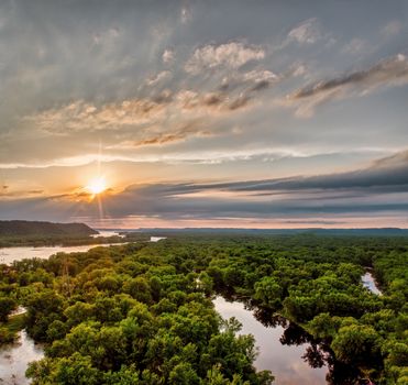 Stunning aerial view of lush forest in Wabasha, Minnesota at sunset.
