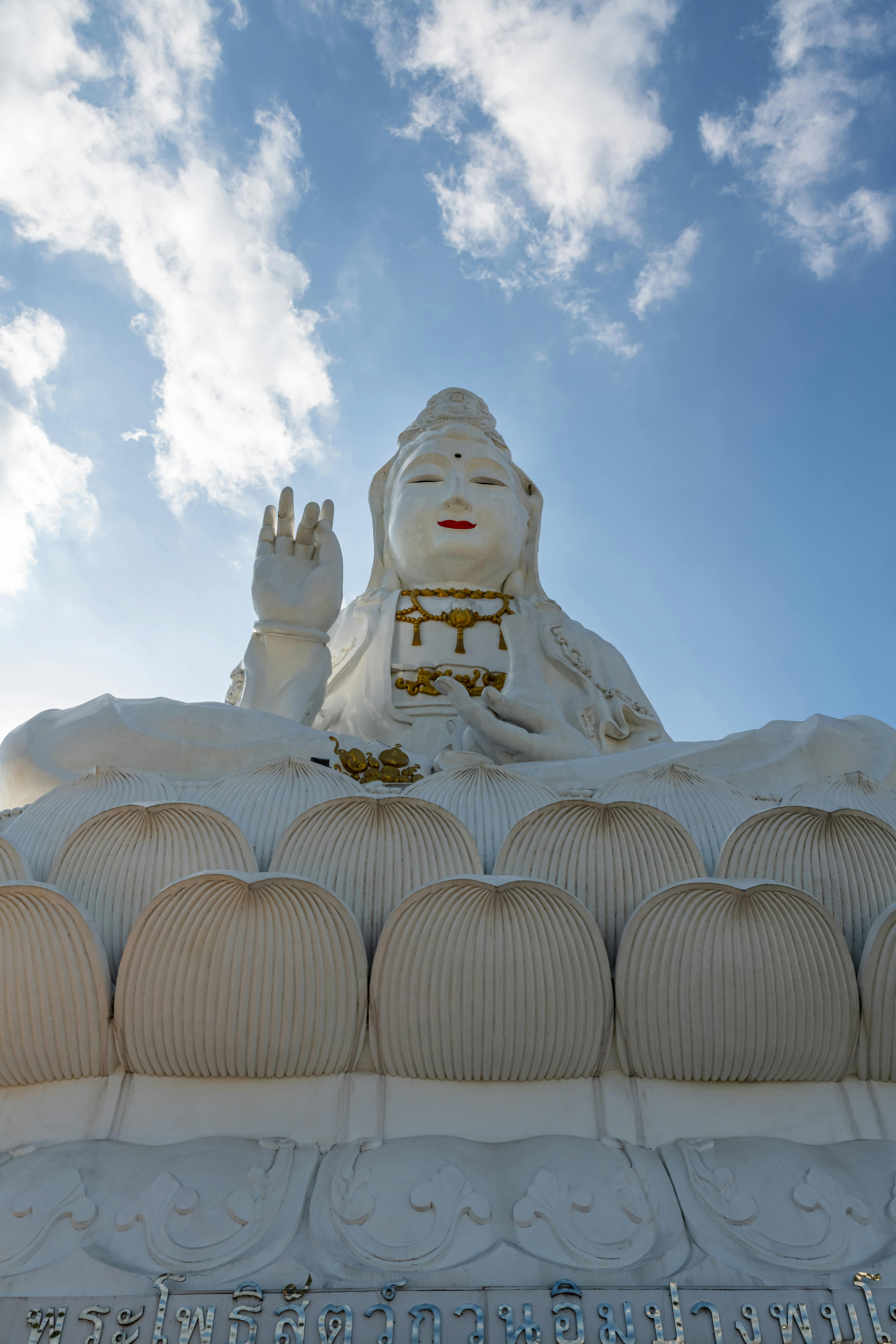 Stunning white Buddha statue at Wat Huay Pla Kang, Chiang Rai, Thailand.