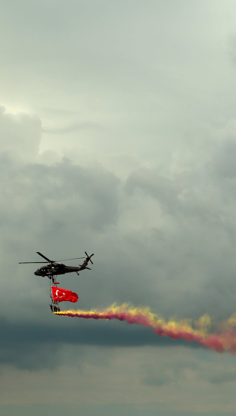 Helicopter Flying With Flare And Flag Of Turkey