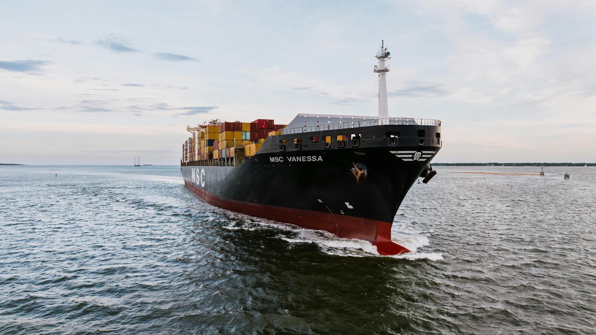 Large Container Ship Sailing on Water