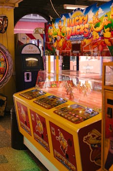 Colorful retro arcade game machine in a fun entertainment setting, showcasing vintage gaming appeal.