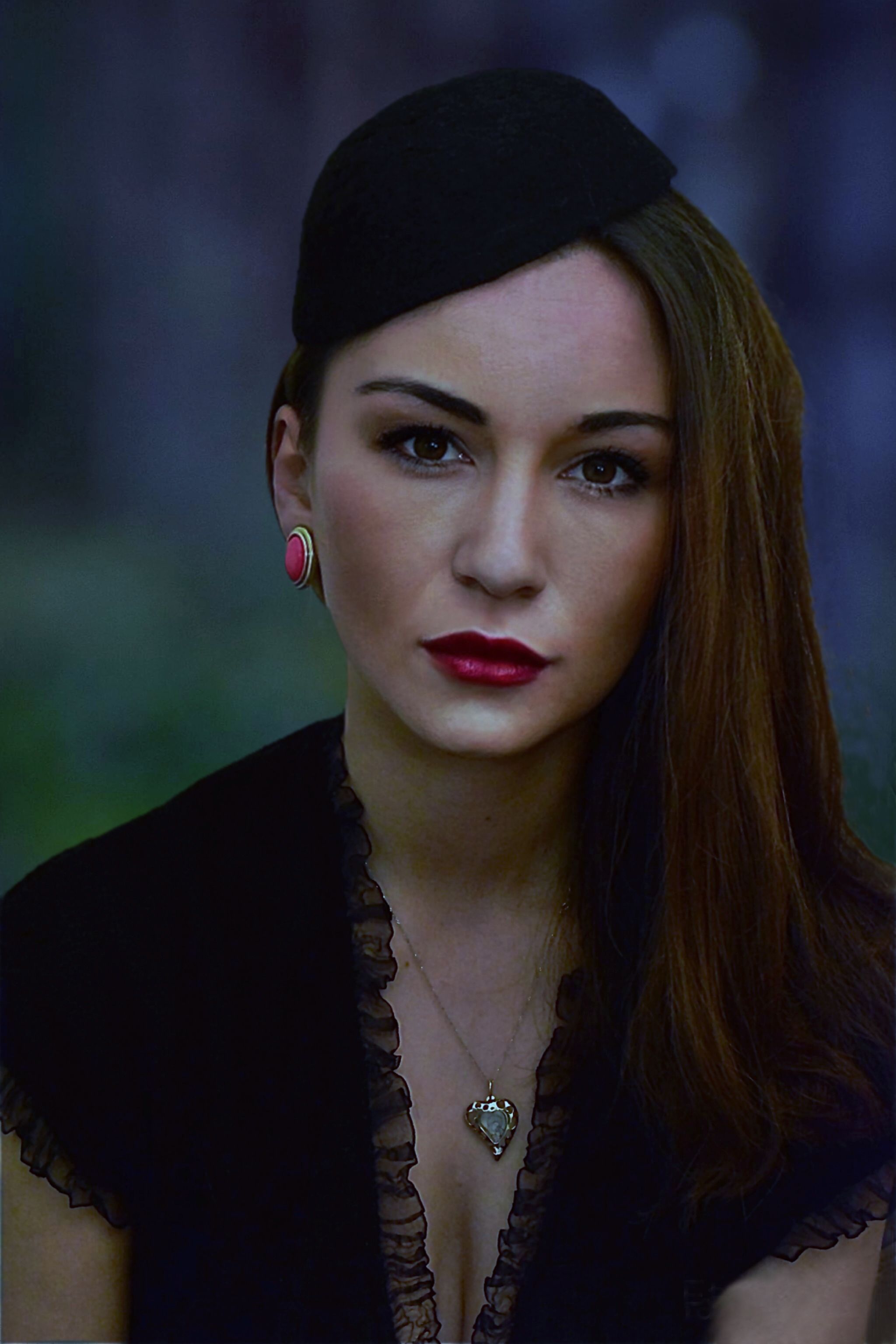 Striking vintage portrait of a woman wearing a black beret and elegant jewelry in Skopje, North Macedonia.