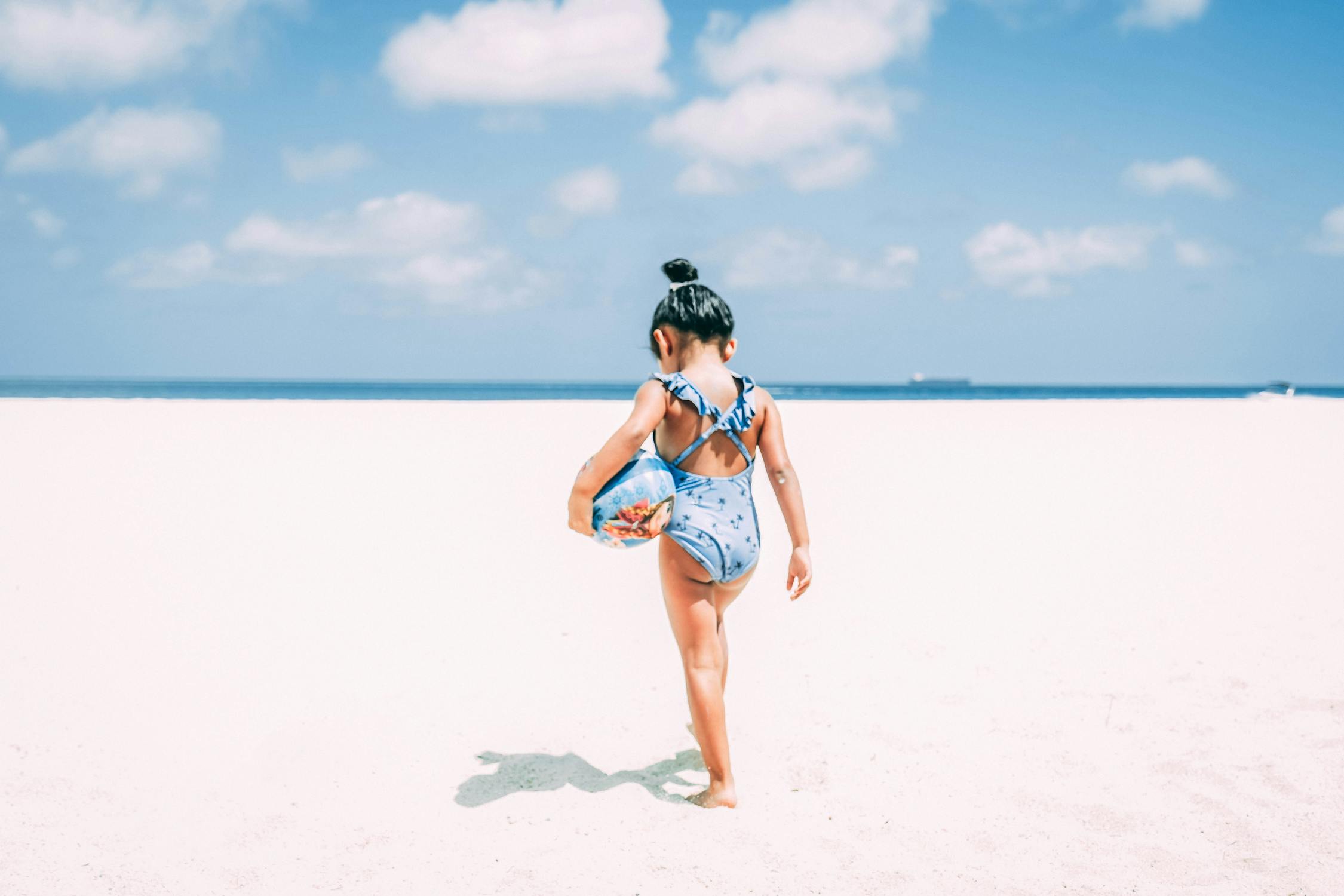 photo-of-girl-holding-a-ball-free-stock-photo