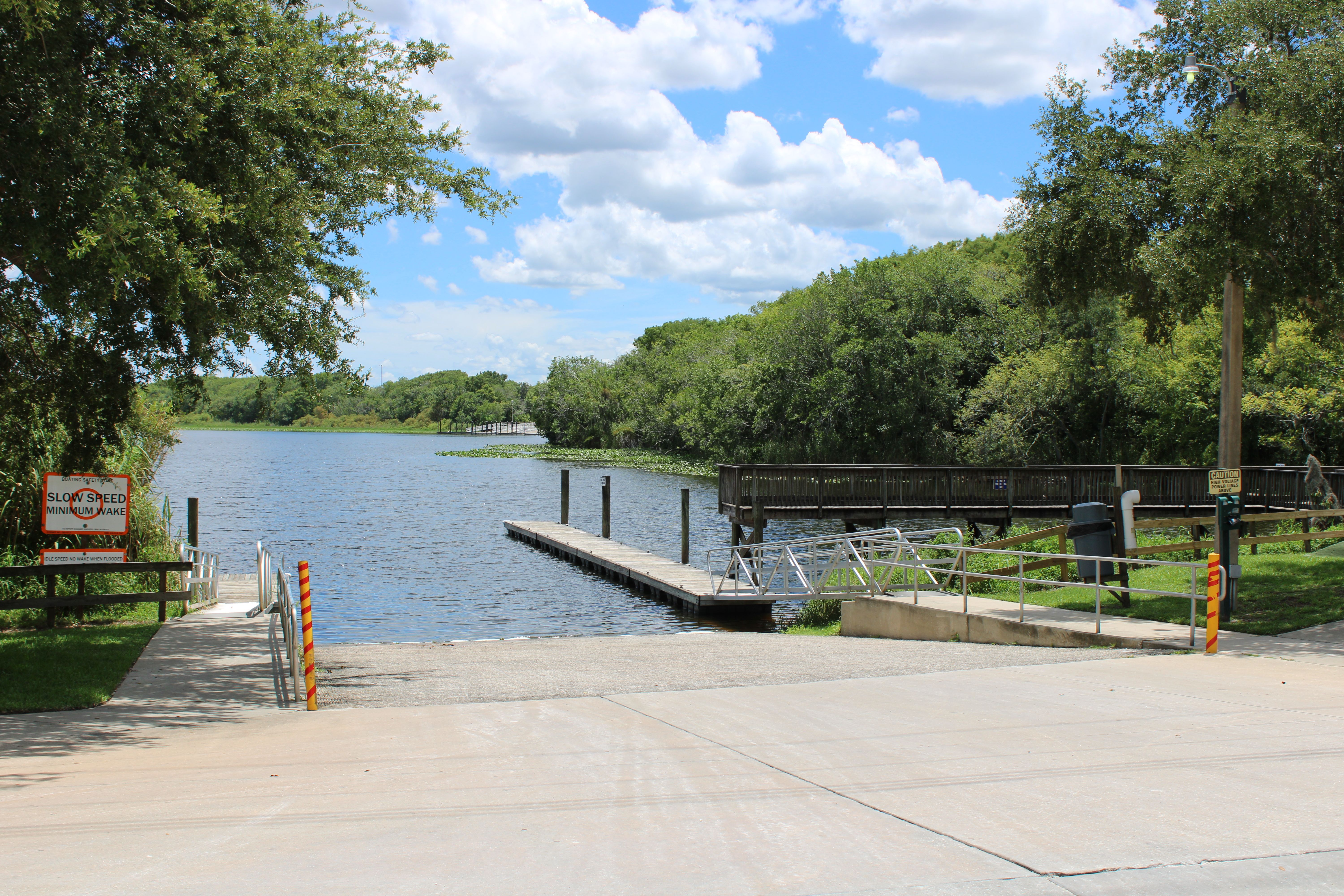 A boat dock with a boat and a boat ramp · Free Stock Photo