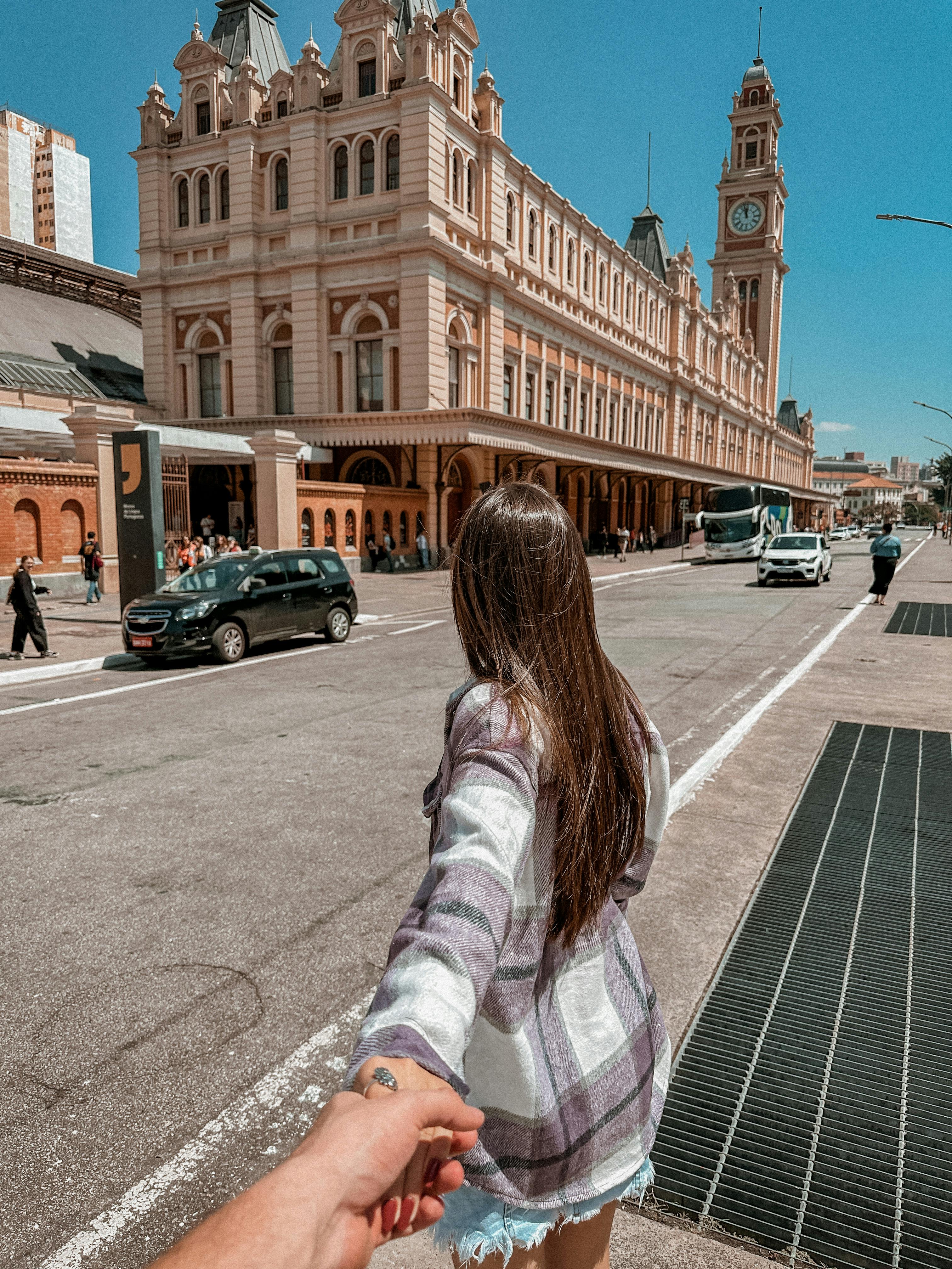 woman in front of museum of the portuguese language in sao paulo in brazil