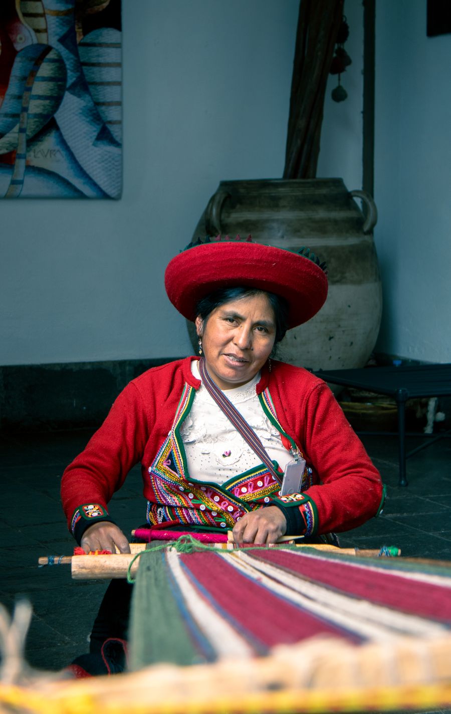 Maria Quispe weaving at her loom