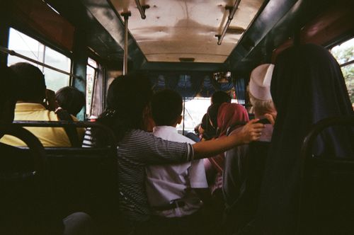 Free Passengers seated inside a crowded bus in Jakarta, Indonesia, during daytime. Stock Photo