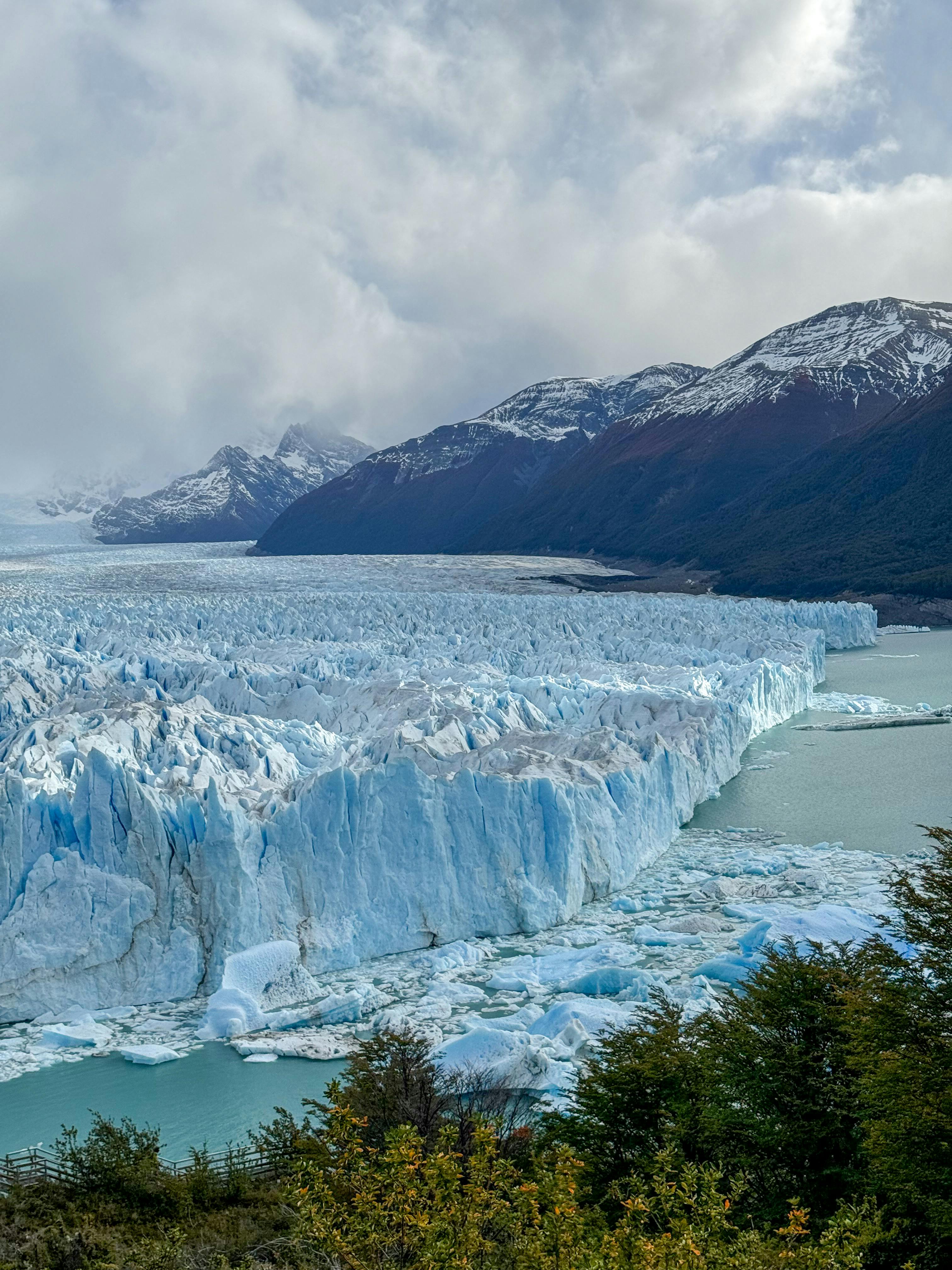 Majestic Perito Moreno Glacier with icy peaks and serene surroundings in Los Glaciares National Park, Argentina.