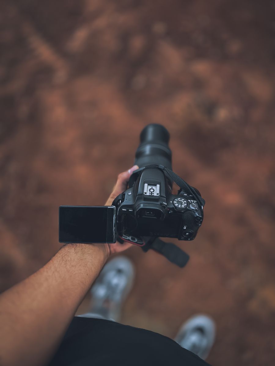 Hand holding a camera