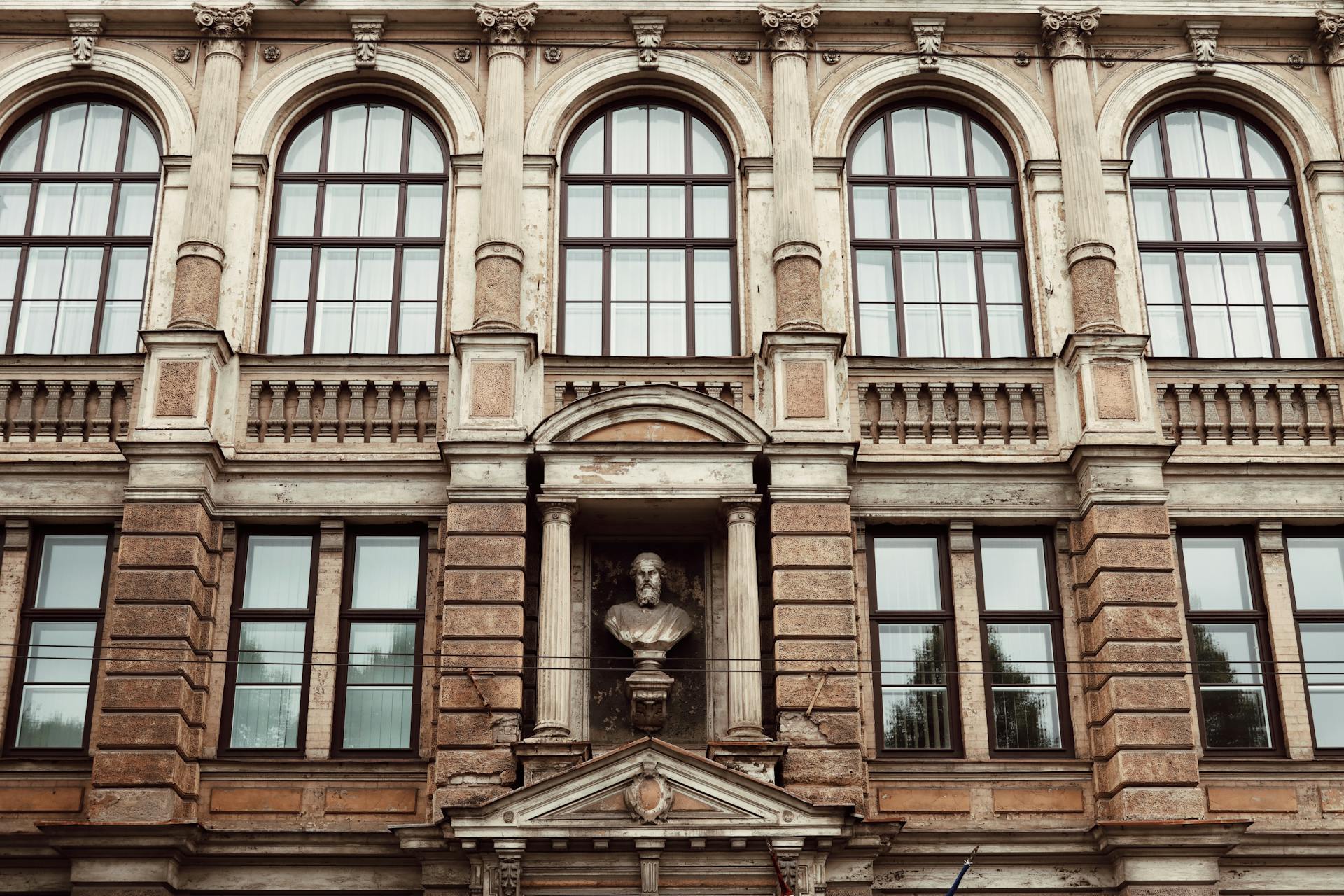 Elegant facade of a historic building in Riga with classical architectural elements.