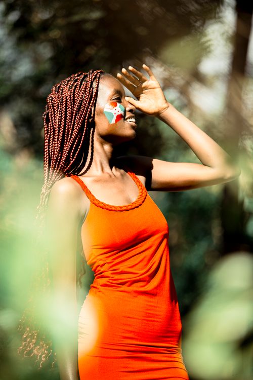 A Young Woman with the Flag of Burundi Painted on Her Cheeks Standing in a Park Free Stock Photo A Young Woman with the Flag of Burundi Painted on Her Cheeks Standing in a Park Free Stock Photo
