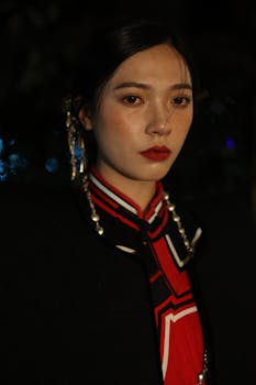 Stylish portrait of a woman in a fashionable red outfit, showcasing elegance and sophistication.