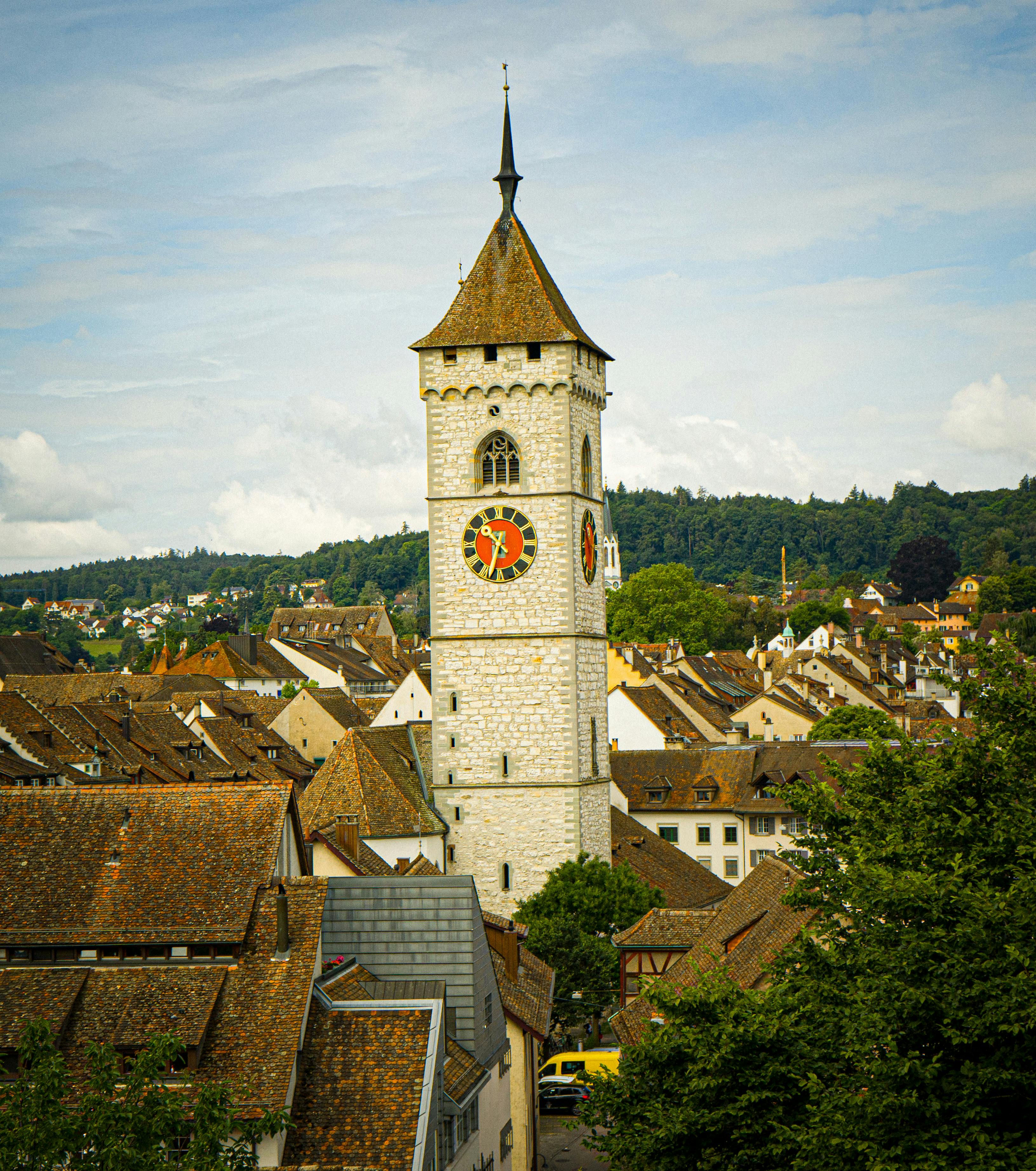 Picturesque view of St. Johann Church Tower amidst the rooftops in Schaffhausen, Switzerland.