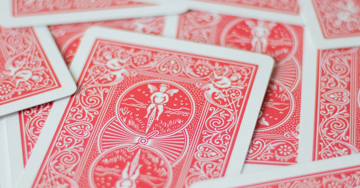 Cards Pile Pattern A pile of red playing cards with a red heart · Free Stock Photo
