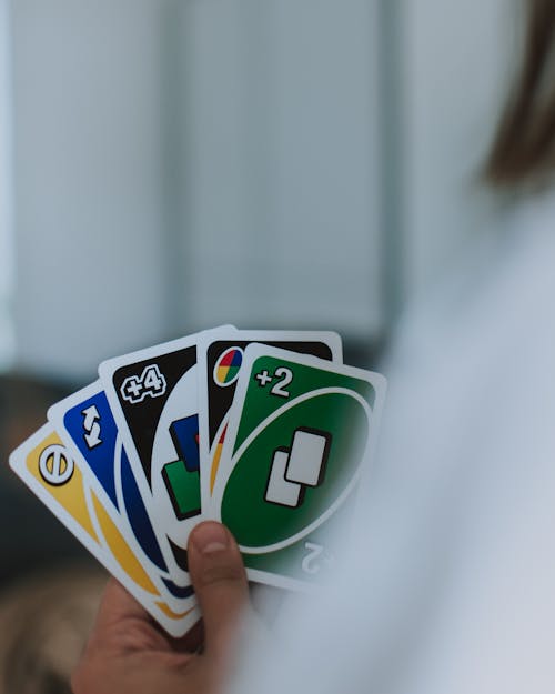 Free Person Holding Uno Cards Stock Photo